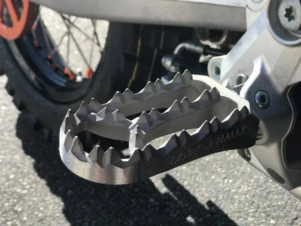 A close up of a rally foot peg on a motorcycle