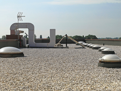 Roofing Contractor — Roofing Contractor Installing Metal Roof Tile In Albuquerque, NM