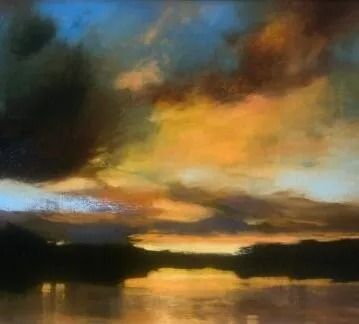 Sunset over calm water, with a vibrant sky of orange, blue, and brown hues.