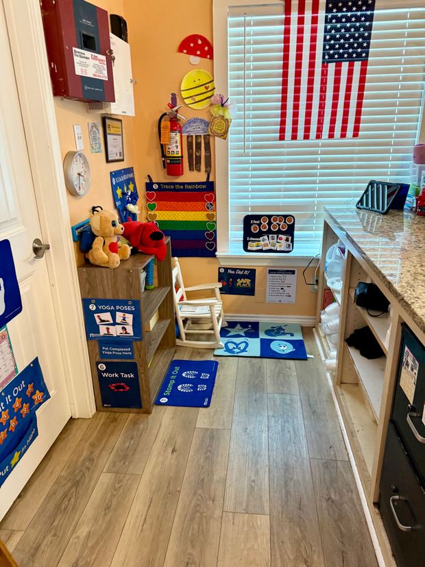 A room filled with lots of toys and a table and chairs.