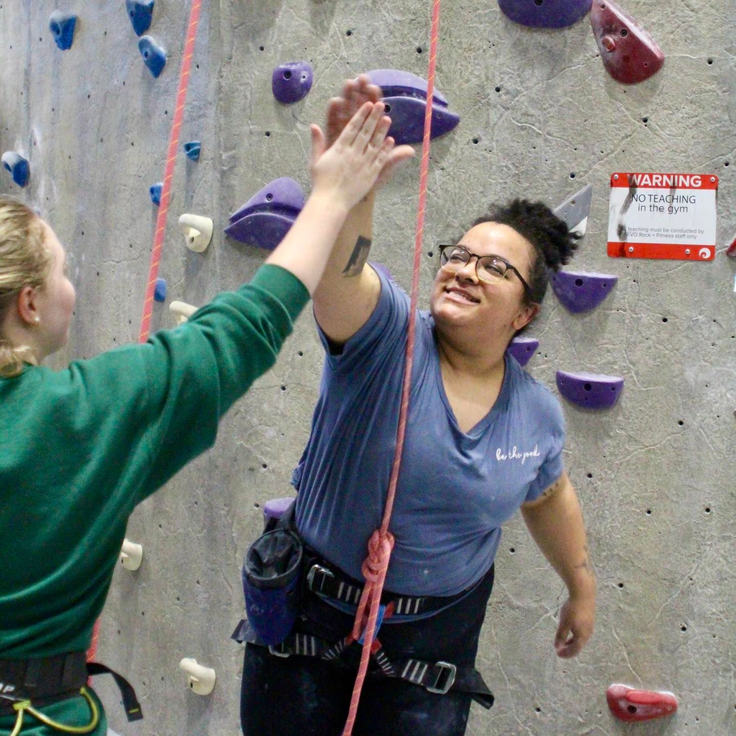 Two people high-fiving
