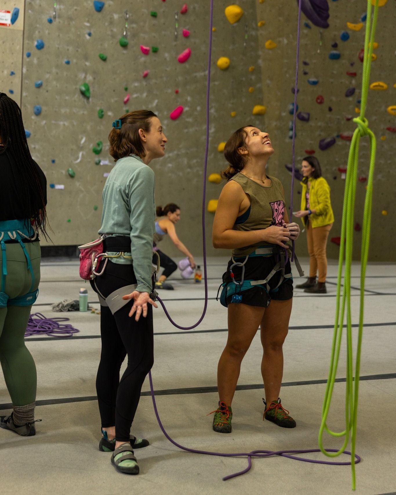 Two people at an indoor climbing wall