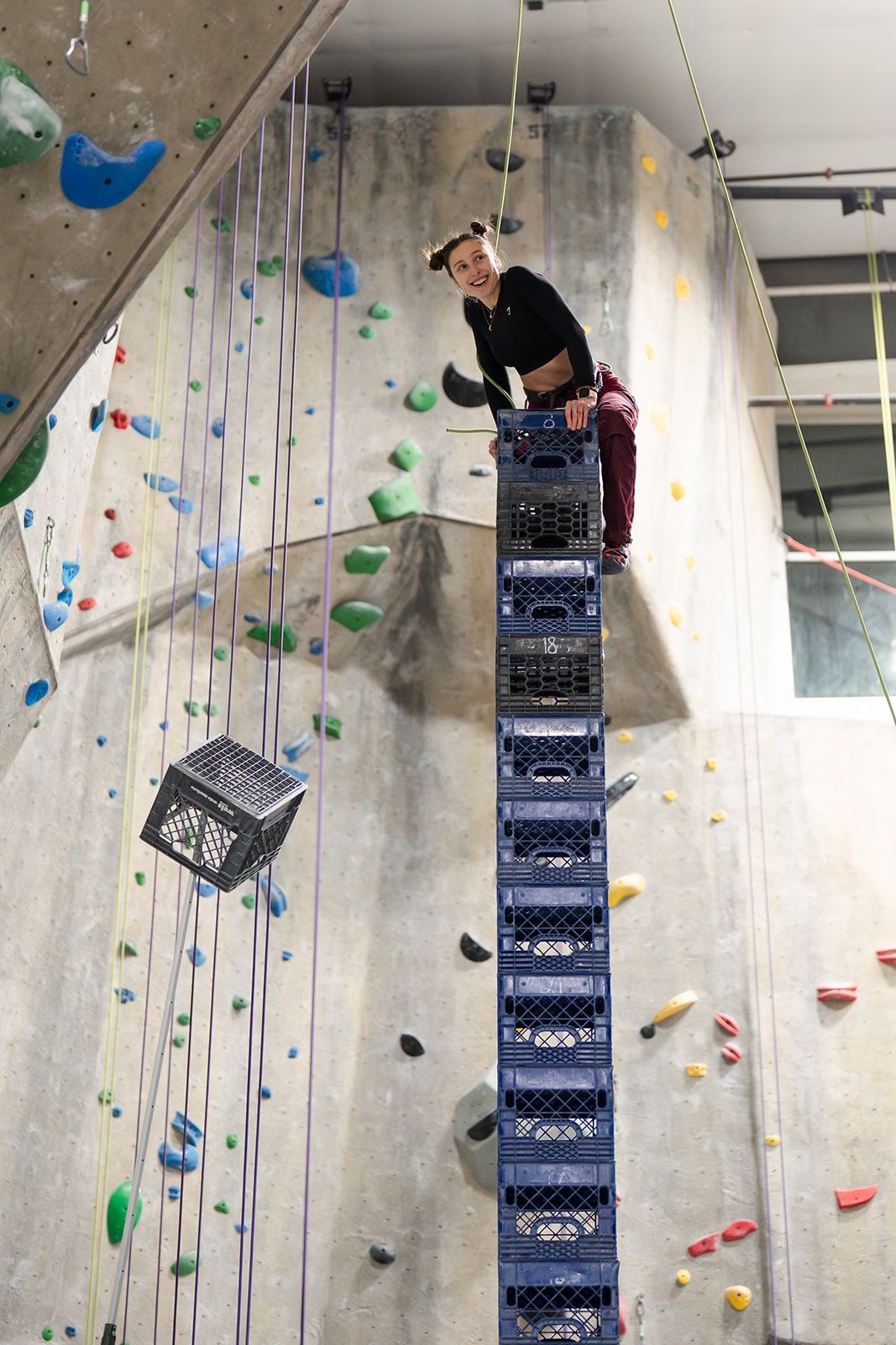 Person balances on stacked crates