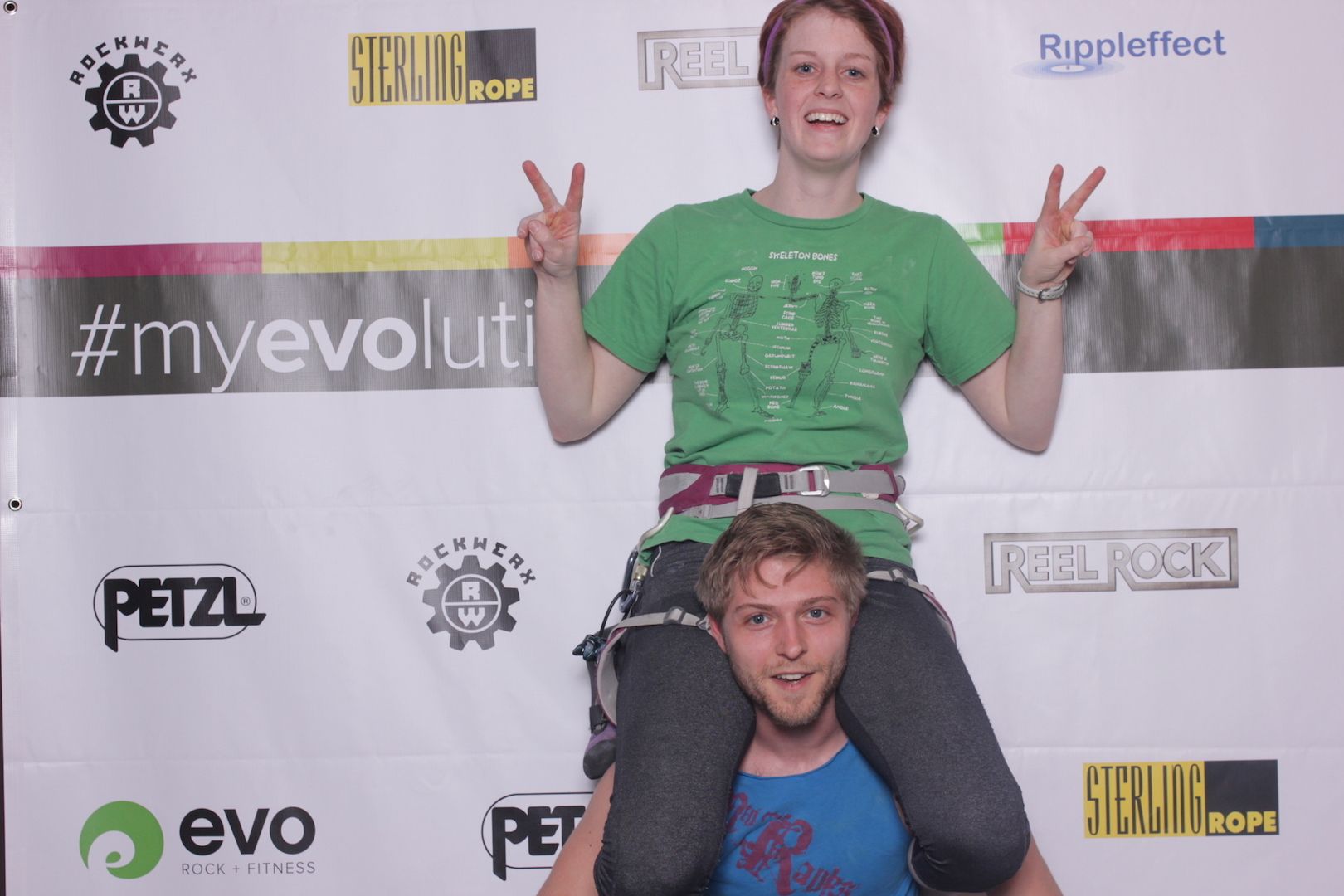 posing in front of a branded backdrop 4