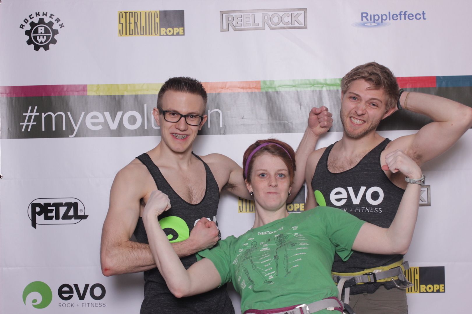 posing in front of a branded backdrop 5