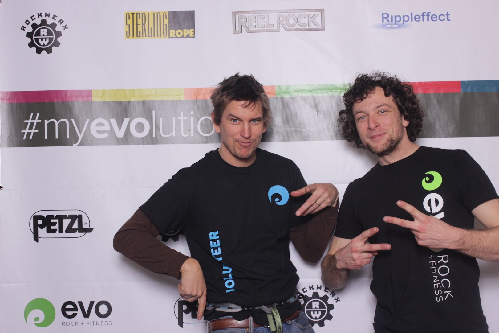 posing in front of a branded backdrop 7