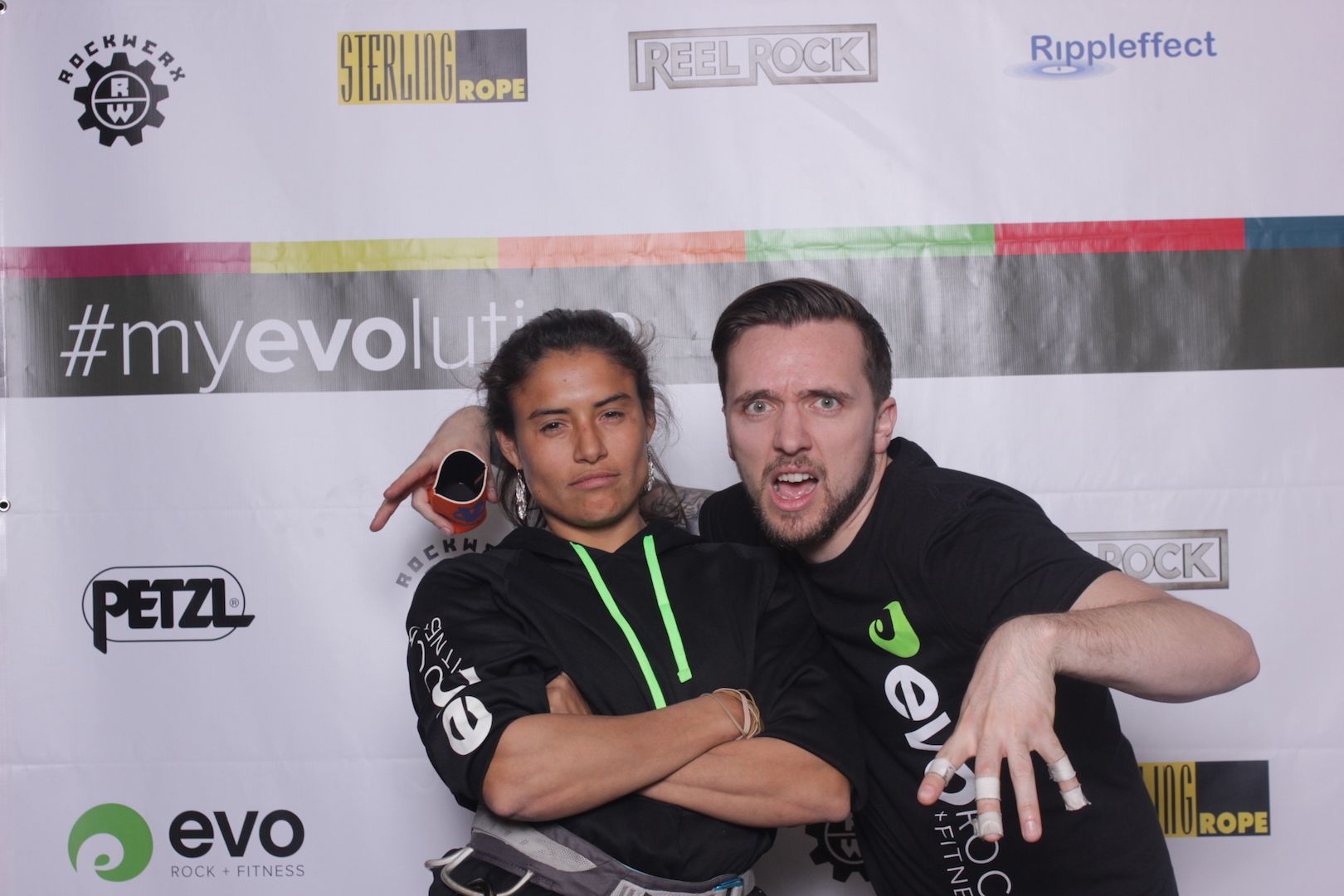 posing in front of a branded backdrop 19