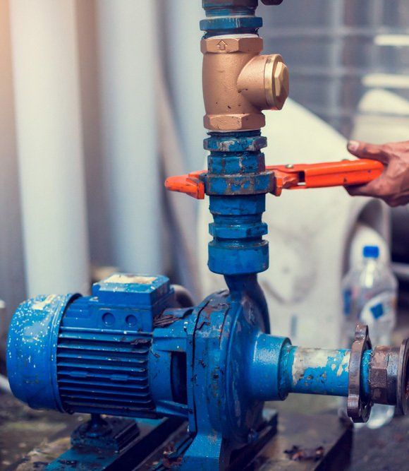 Plumber Holding Wrench - Drilling or Bore Pump Service in South Kolan, QLD