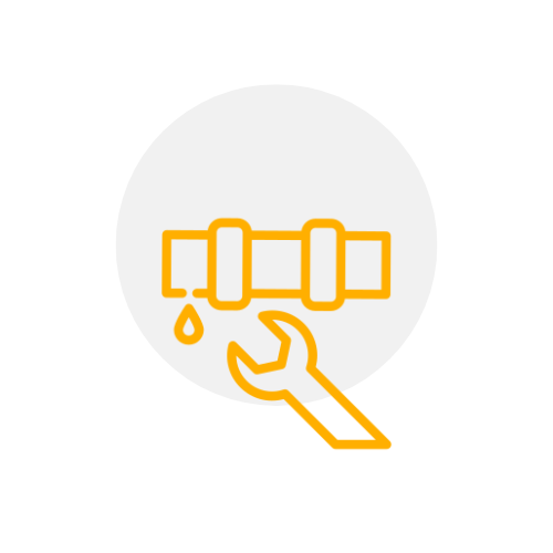 A hand is holding a wrench next to a pipe.