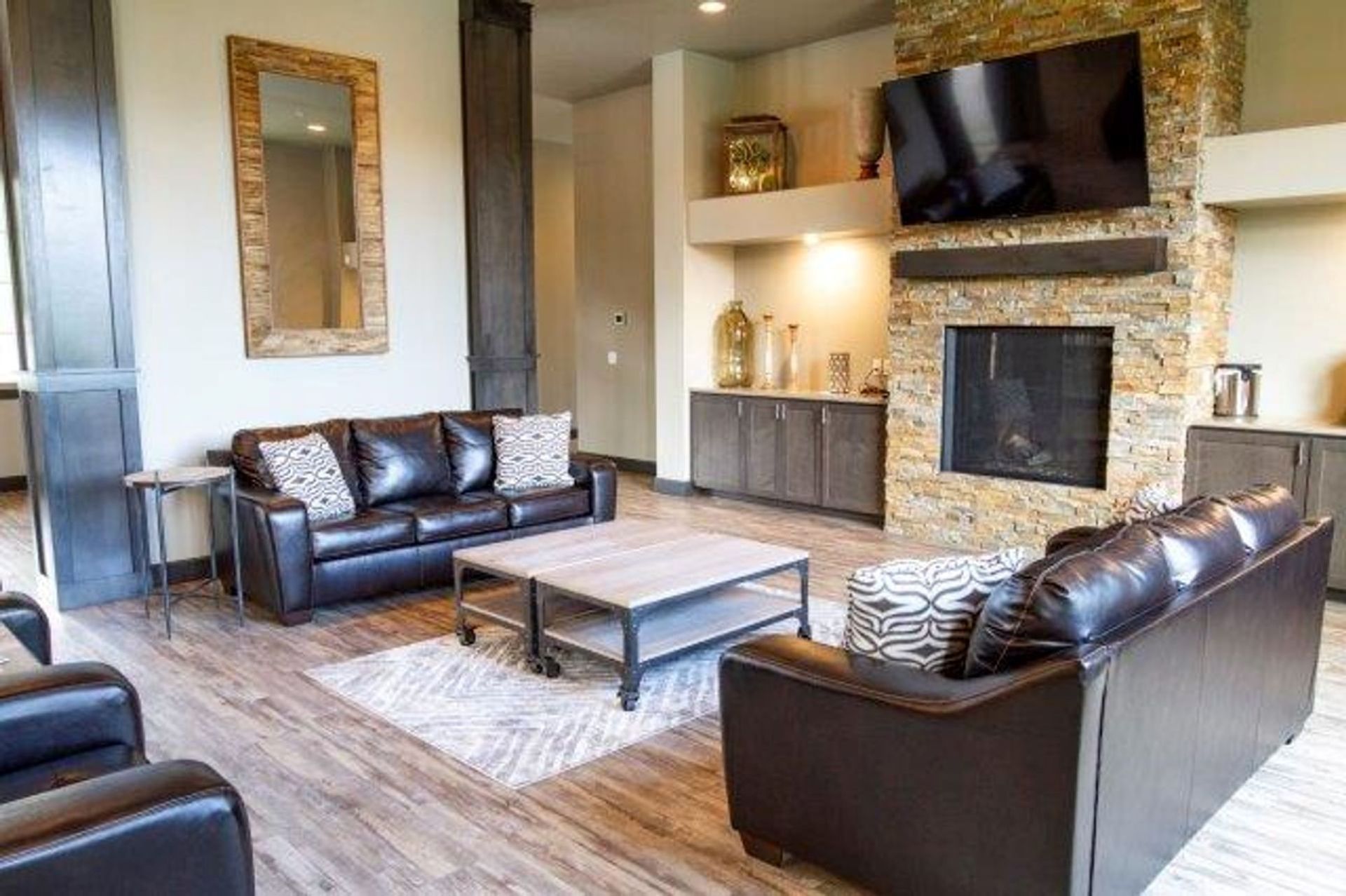 A living room filled with furniture and a fireplace.