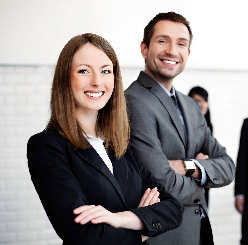 A Man And A Woman Are Posing For A Picture With Their Arms Crossed — New Hire in Newcastle, NSW