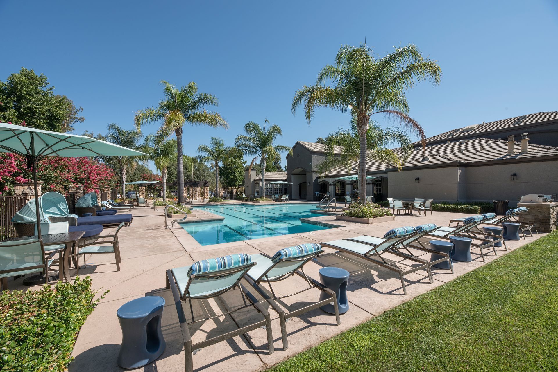 Spacious open-concept living area with fireplace, dining table, kitchen island, and couches.