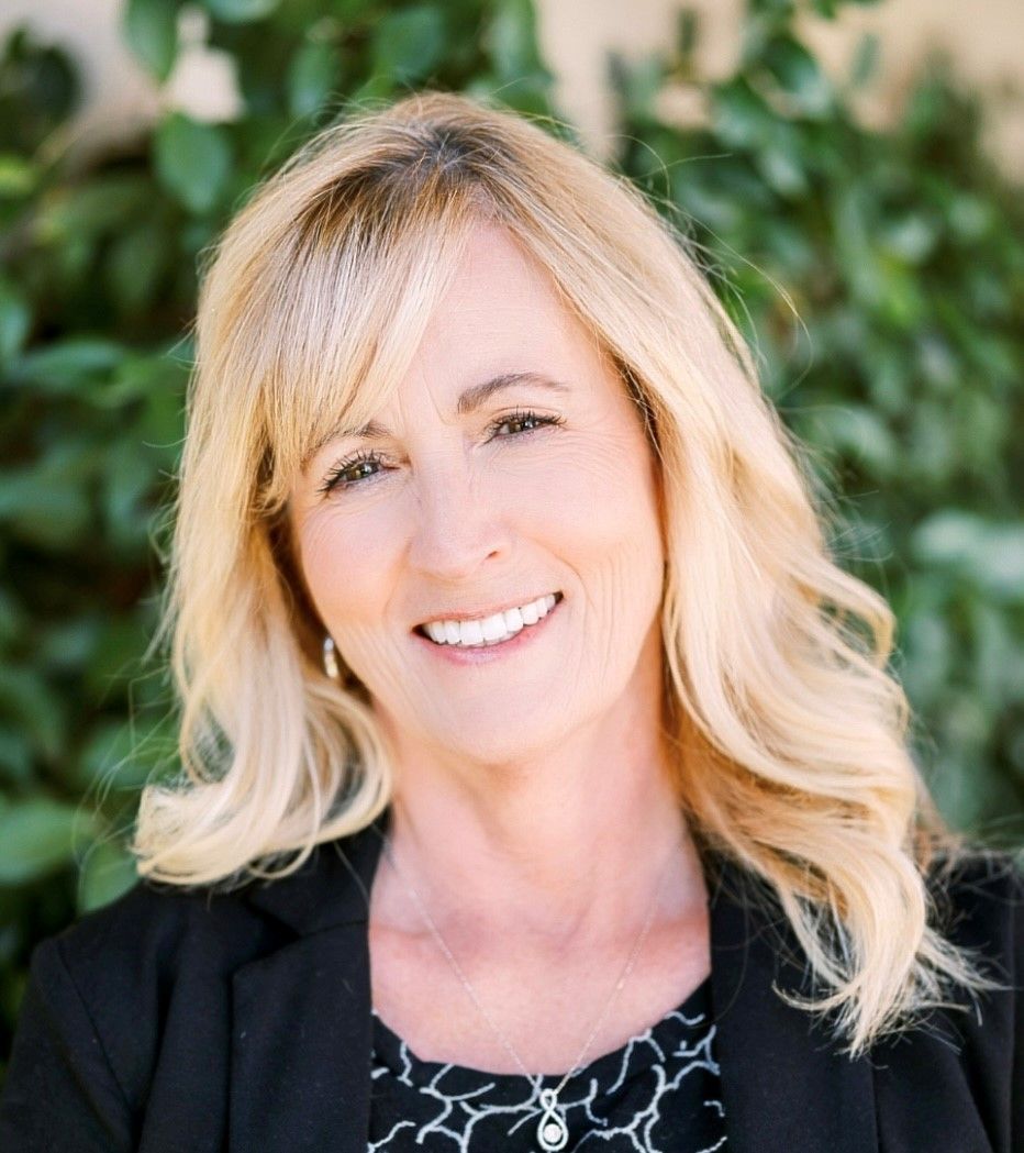 A silhouette of a person in a circle on a white background.