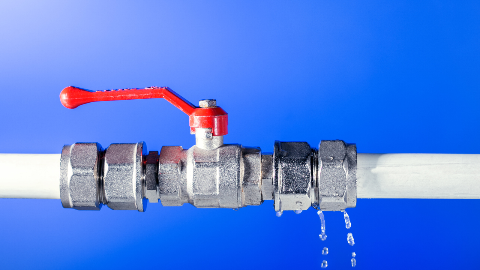 Commercial plumbing leak causing water damage in business building