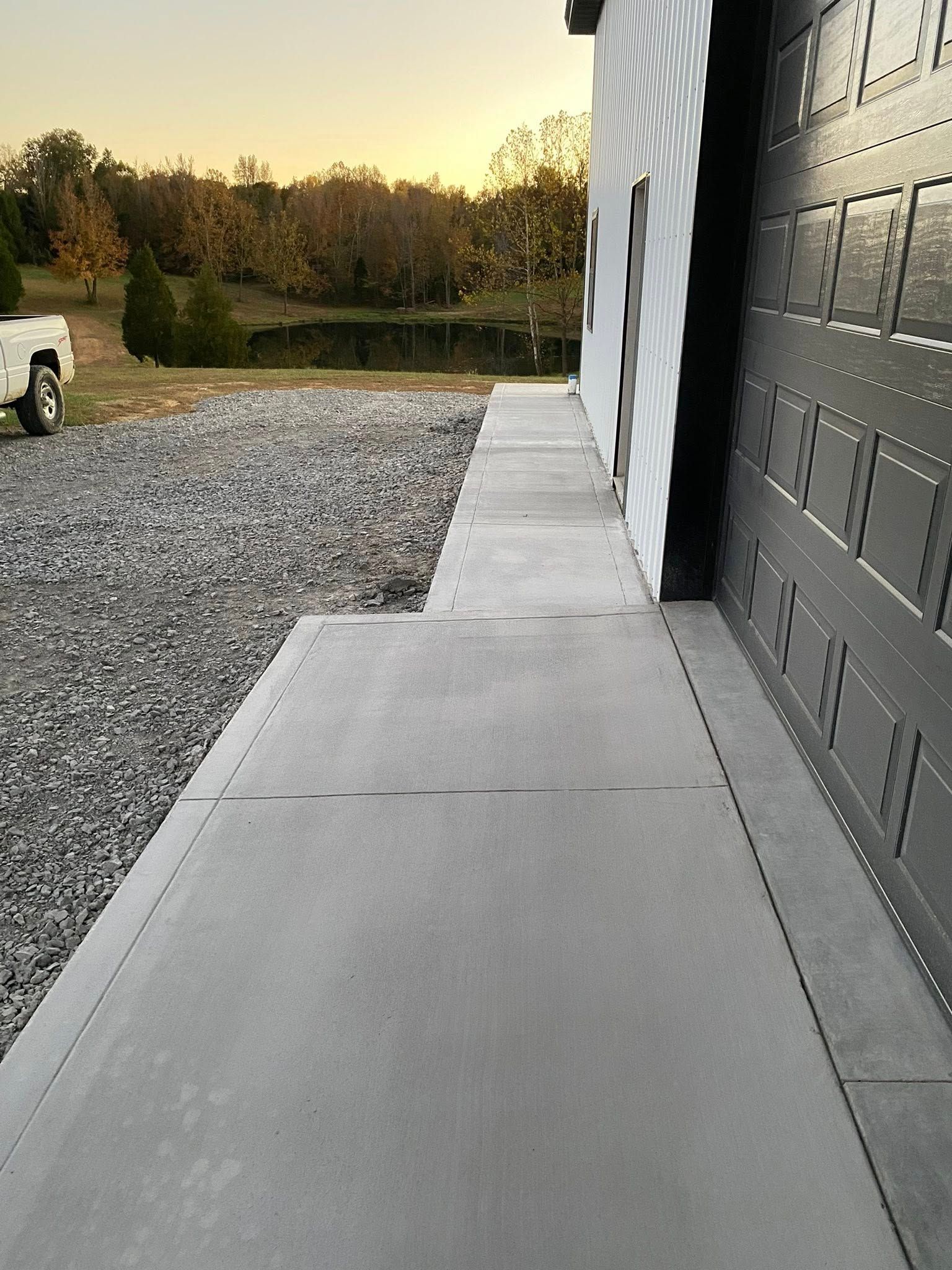 Family gathered at a dining table in a kitchen. They are eating and talking together.