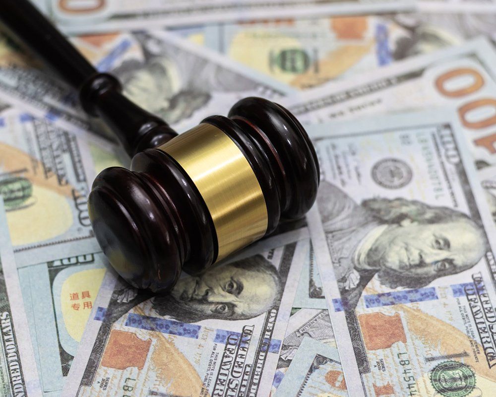 Money and Hammer — Clinton Township, MI — Gigliotti & Associates, PC