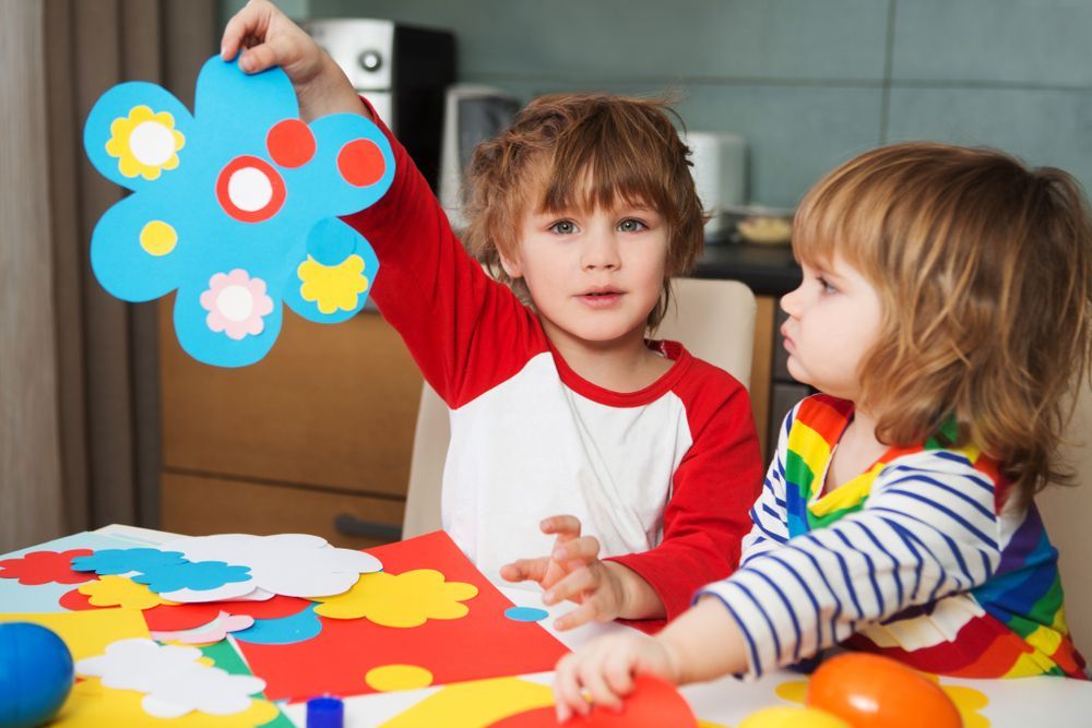 Two Children Crafting Paper Flowers at A Table — Five Star Family Day Care in Newcastle, NSW