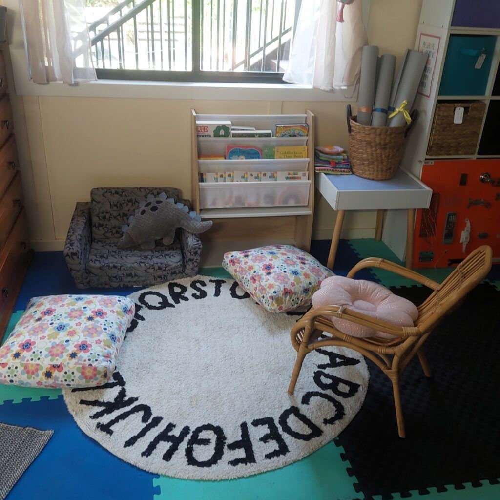 A Cozy Reading Nook with A Rug, Books, Small Chairs, and Pillows — Five Star Family Day Care in Maitland, NSW