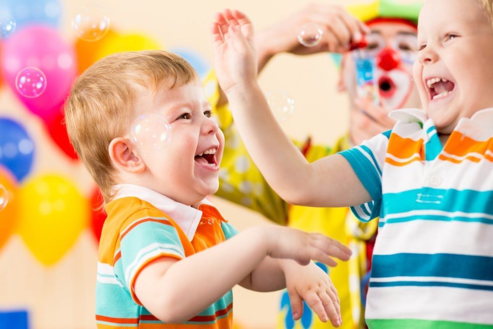 Two Young Boys Laughing — Five Star Family Day Care in Metford, NSW