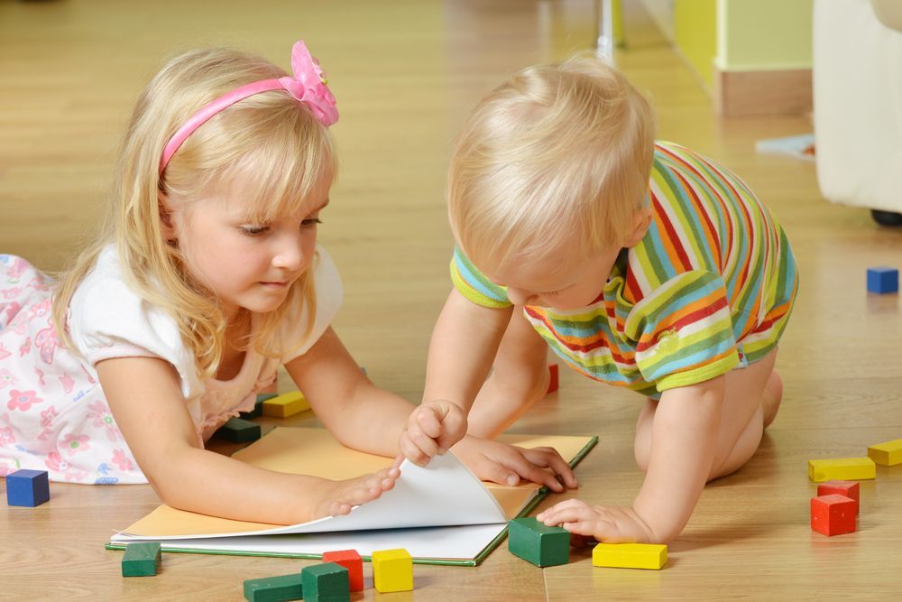 Two Young Children Playing With Building Blocks — Five Star Family Day Care In Muswellbrook, NSW