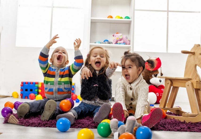 Three Excited Children Laughing and Playing — Five Star Family Day Care in Maitland, NSW