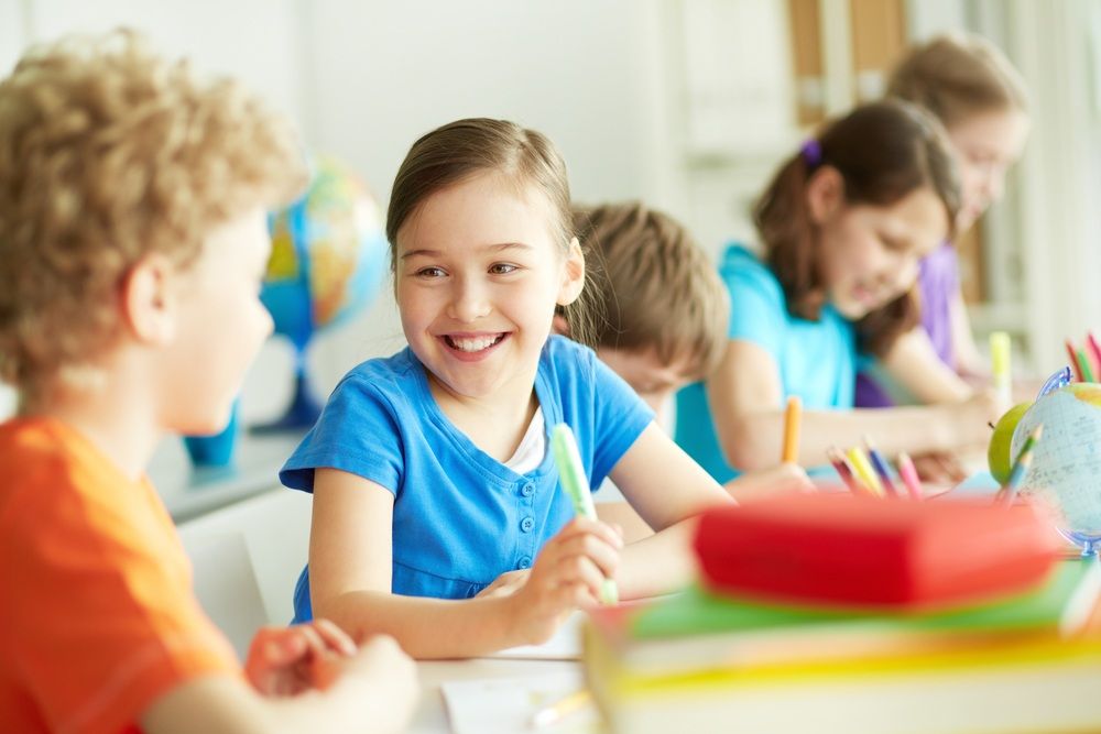 Children in Classroom Smiling and a Girl With Blue Shirt — Five Star Family Day Care In Newcastle, NSW