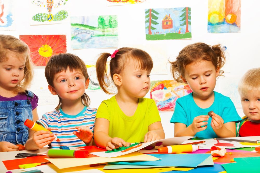 Children at an Art Table Working on Crafts — Five Star Family Day Care In Metford, NSW