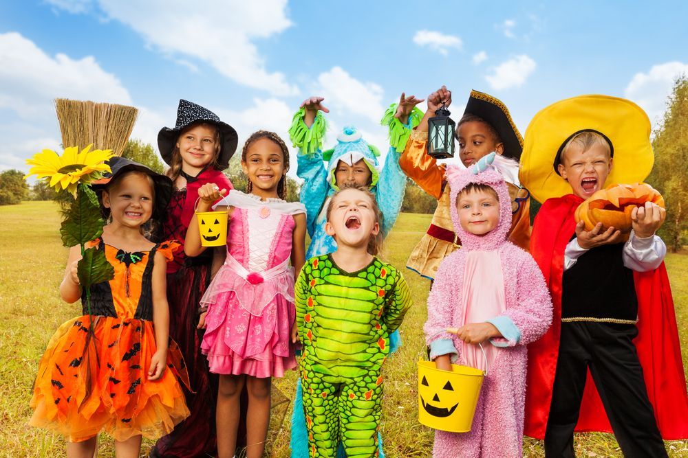 Children in Halloween Costumes Smiling Outdoors — Five Star Family Day Care in Lake Macquarie, NSW