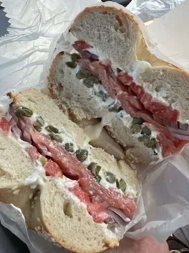 Bagel sandwich with smoked salmon, capers, and cream cheese.