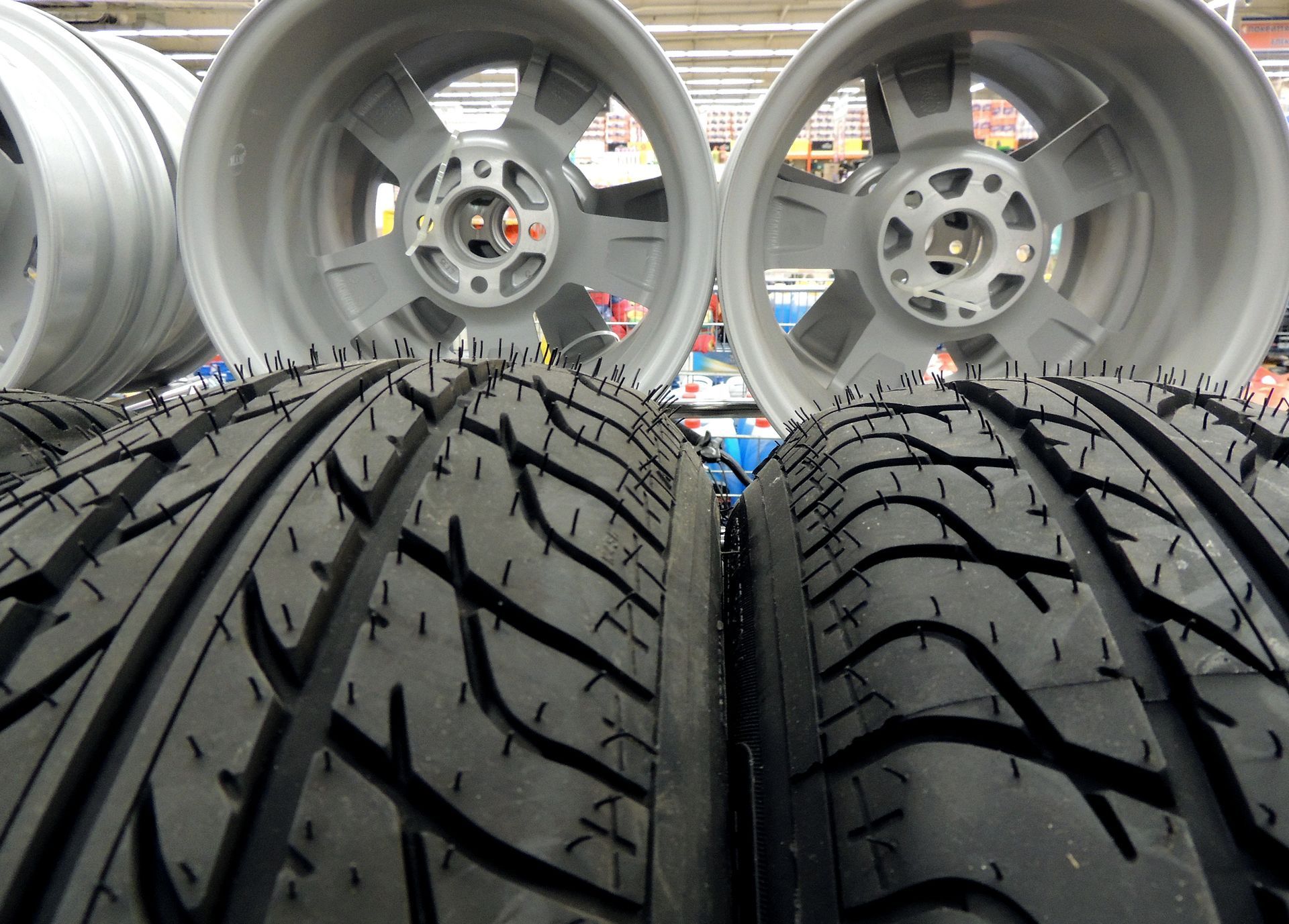 A stack of tires and wheels in a store | Ruckersville, VA | KEL-CAM Tire & Auto