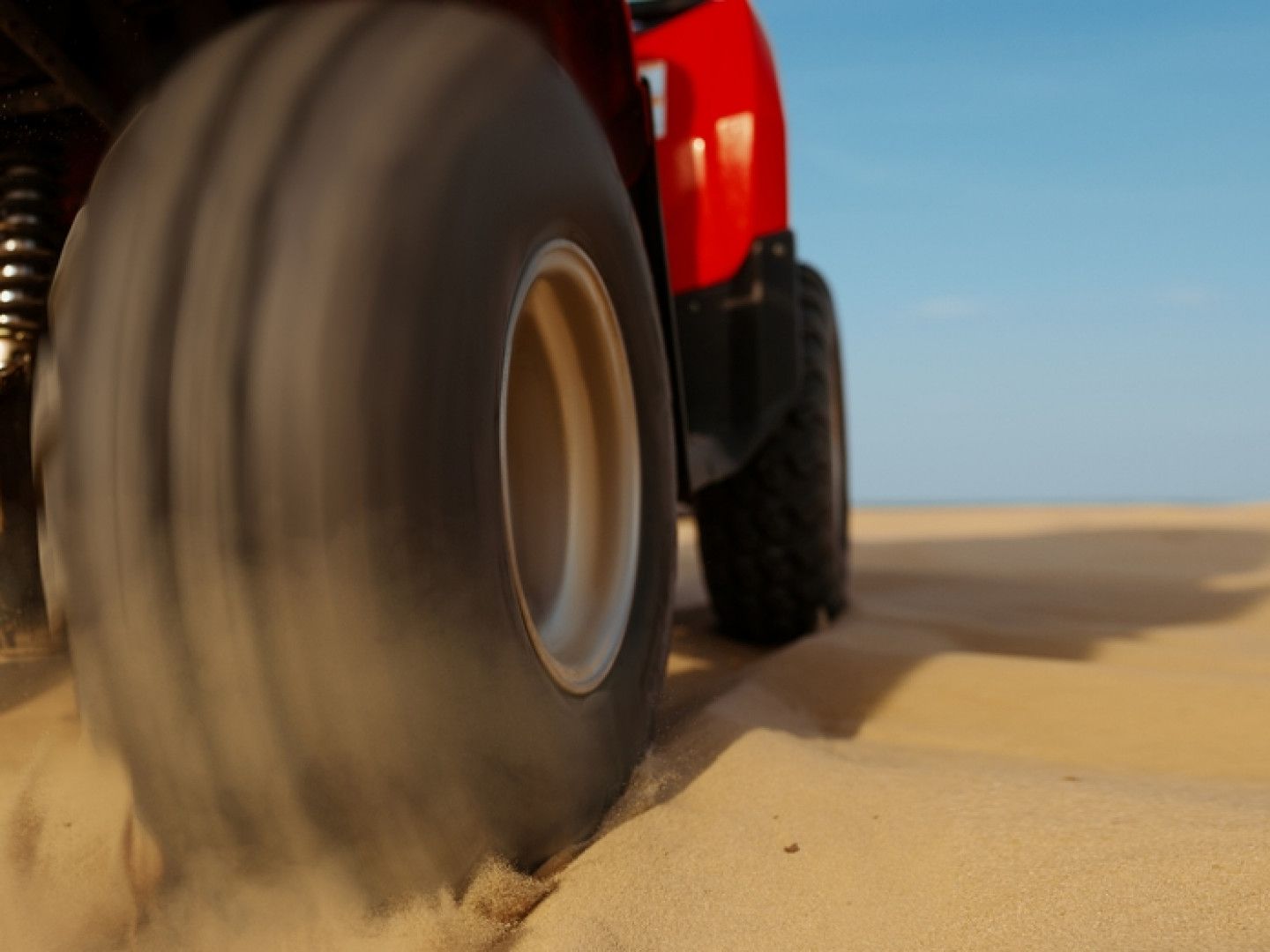 New ATV Tire Rolling on the Sand