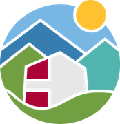 a house is surrounded by mountains and a sun in a circle .