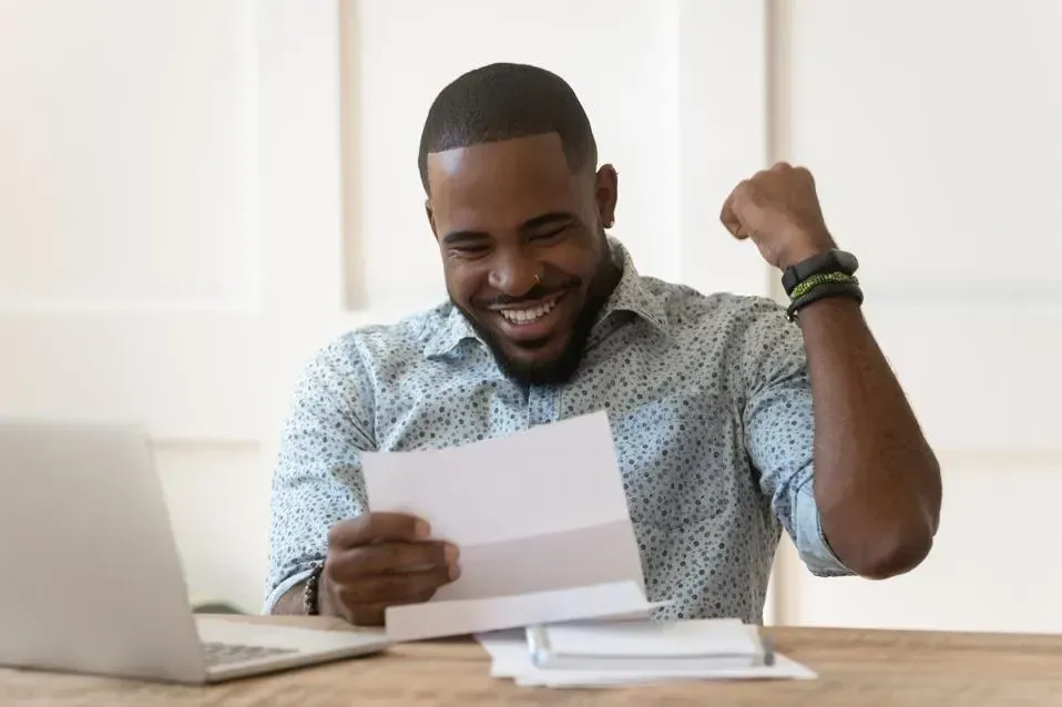 photo of a happy man with a tax refund