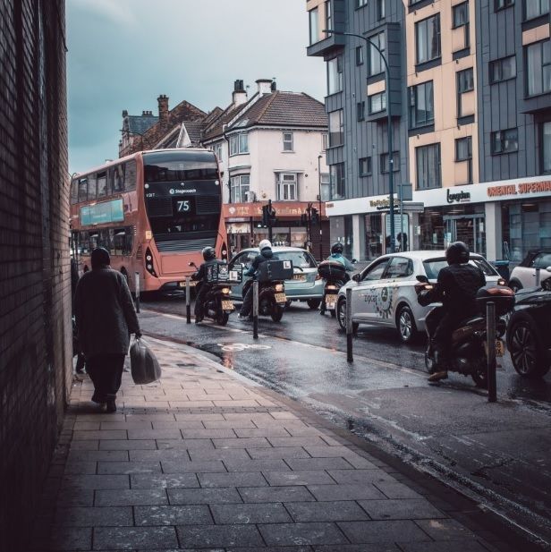 A bus driving down a city street