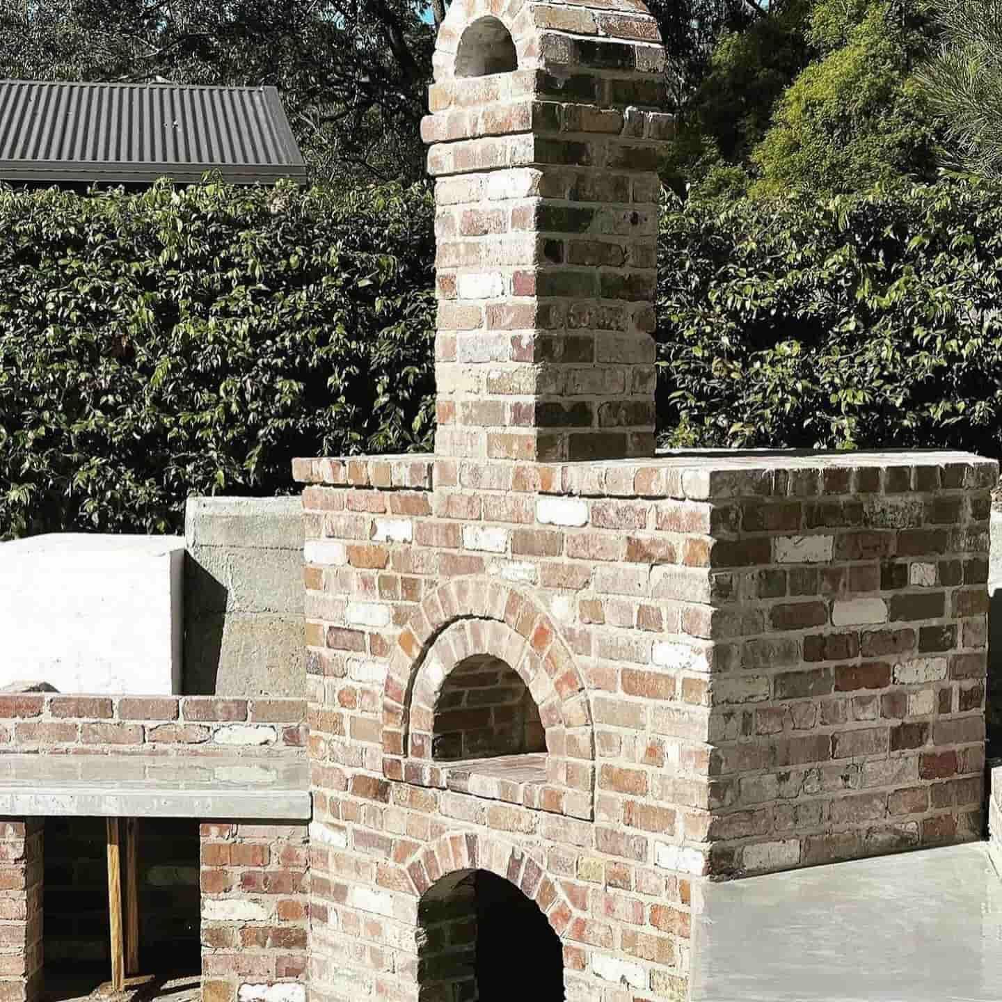 A brick oven with a chimney on top of it  — Premier Bricks, Blocks & Pavers In Heatherbrae, NSW
