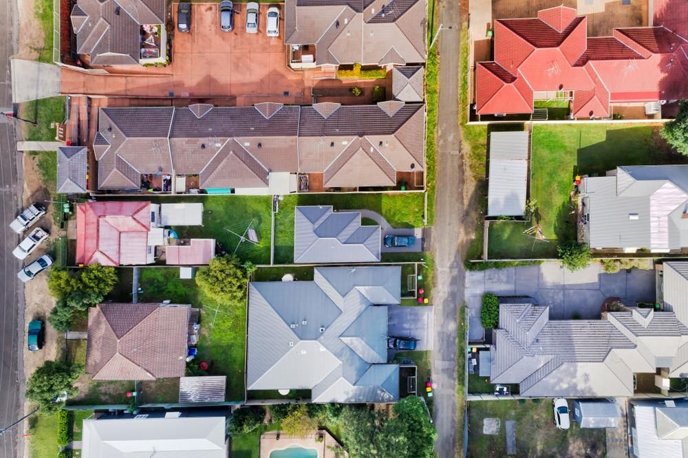 An Aerial View Of A Residential Area With Lots Of Houses And Yards — Premier Bricks, Blocks & Pavers In Cessnock, NSW