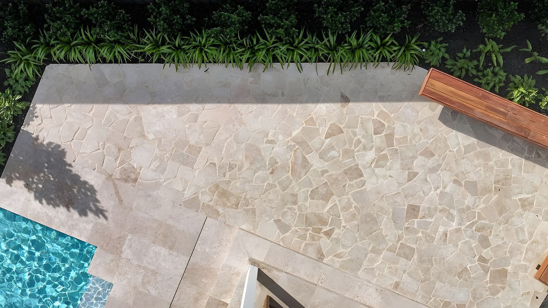 A Patio With A Bench And Pillows On It — Premier Bricks, Blocks & Pavers In Heatherbrae, NSW