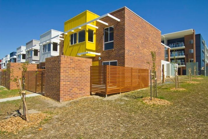 Modern brick and yellow townhouses — Premier Bricks, Blocks & Pavers In Heatherbrae, NSW
