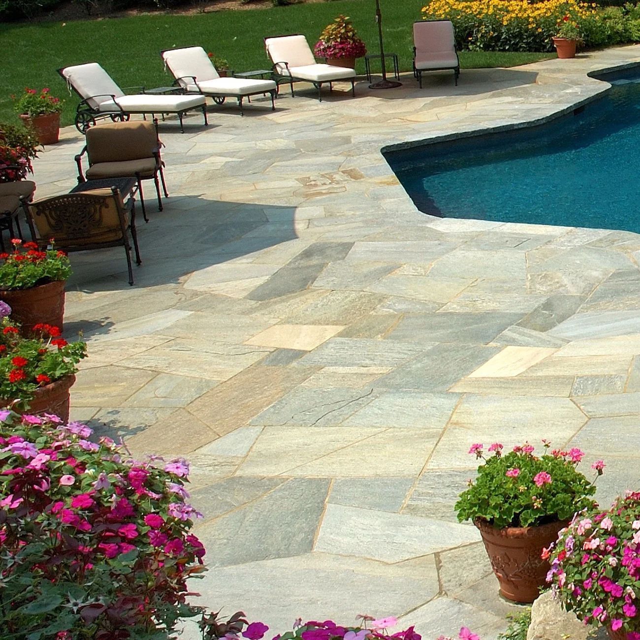Magnolia crazy paving around the pool — Premier Bricks, Blocks & Pavers In Heatherbrae, NSW