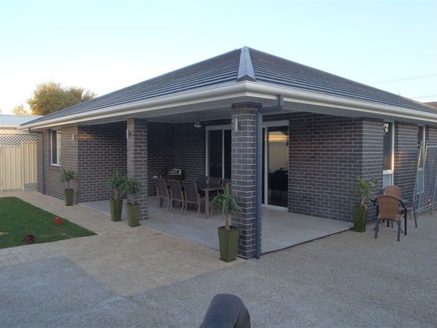 Brick house with a covered patio — Premier Bricks, Blocks & Pavers In Heatherbrae, NSW
