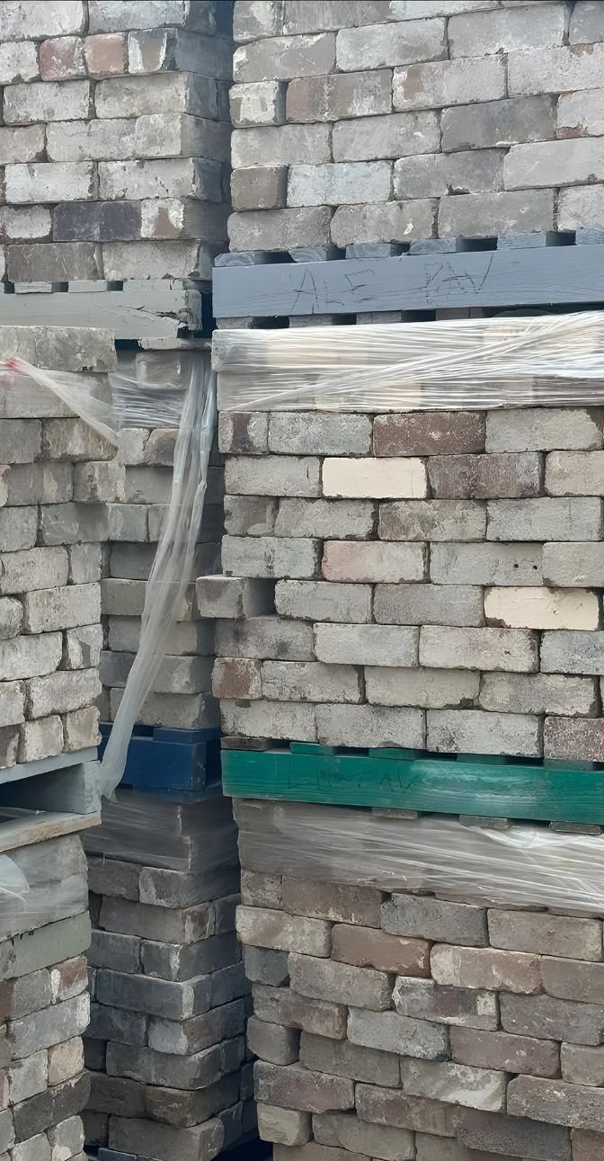 A Pile Of Bricks Stacked On Top Of Each Other On Pallets — Premier Bricks, Blocks & Pavers In Singleton, NSW