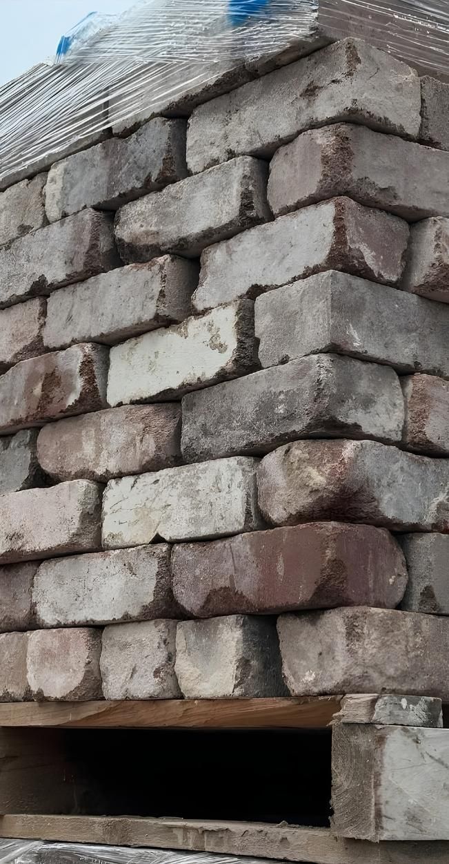 A Pile Of Bricks Stacked On Top Of Each Other On A Wooden Pallet — Premier Bricks, Blocks & Pavers In Singleton, NSW