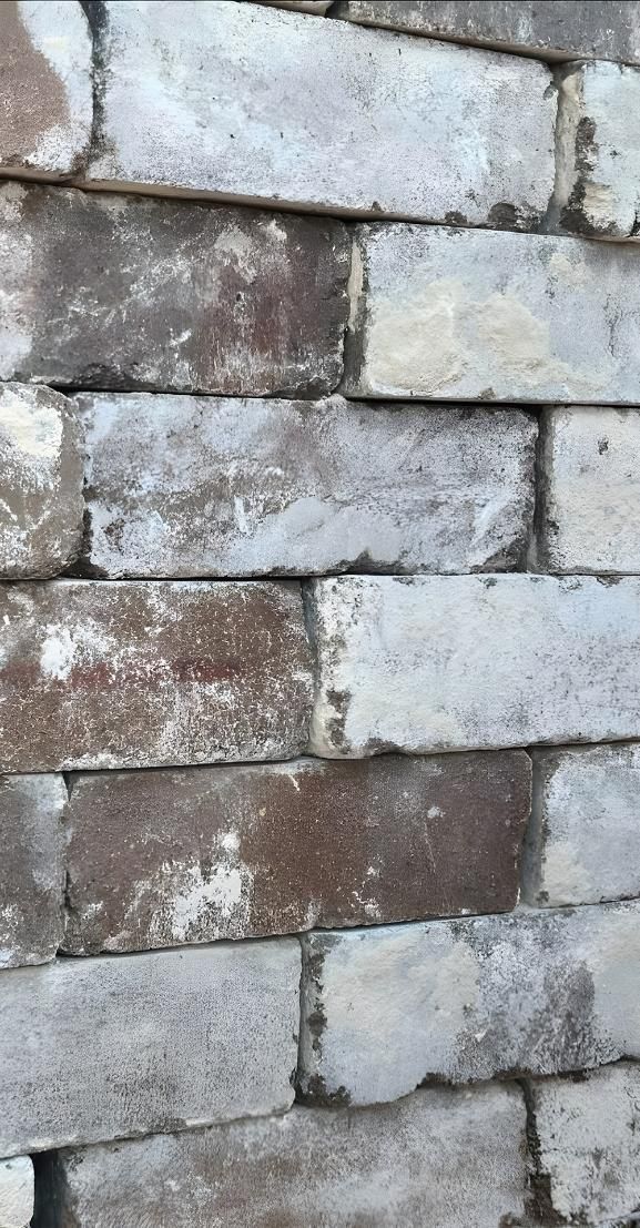 A Close Up Of A Brick Wall With A Lot Of Bricks On It — Premier Bricks, Blocks & Pavers In Lake Macquarie, NSW