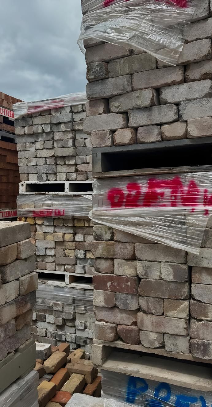 A Pile Of Bricks Stacked On Top Of Each Other On Pallets — Premier Bricks, Blocks & Pavers In Lake Macquarie, NSW