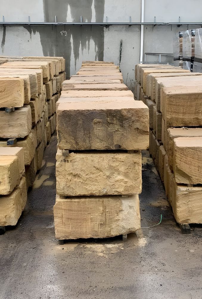 A Warehouse Filled With Lots Of Bricks Stacked On Top Of Each Other — Premier Bricks, Blocks & Pavers In Heatherbrae, NSW