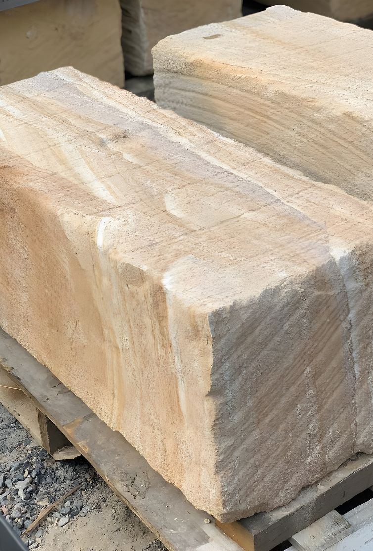 Two Large Bricks Are Sitting On Top Of A Wooden Pallet — Premier Bricks, Blocks & Pavers In Singleton, NSW