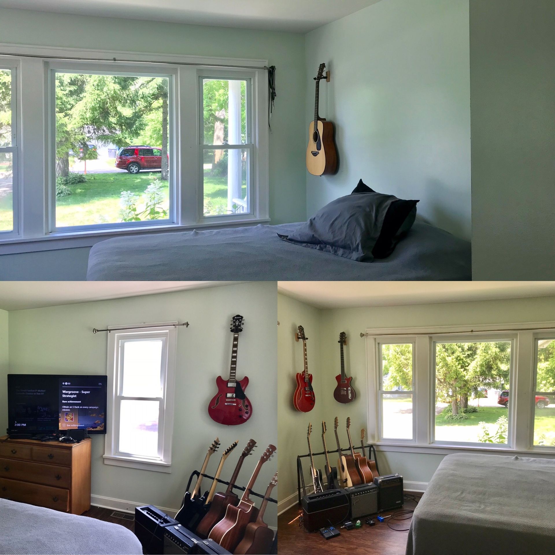 A bedroom with a guitar hanging on the wall