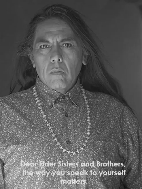 Elder Man with a long hair wearing a beautiful necklace