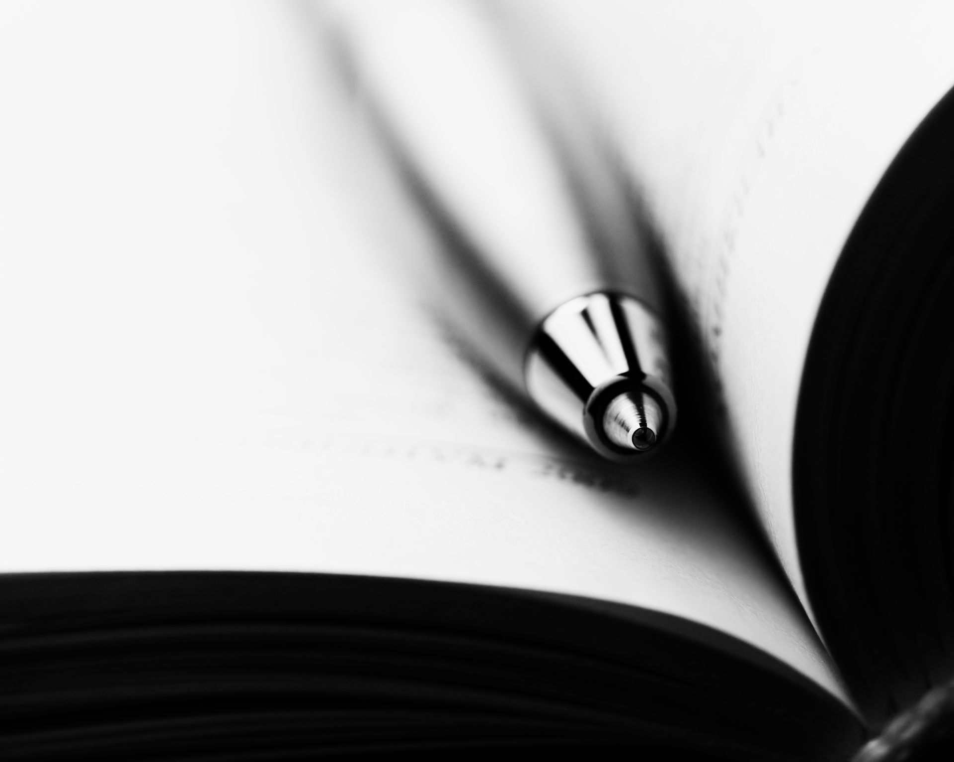 Close Up Photo of a Pen on a Book