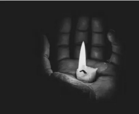 Hand Holding a Candle